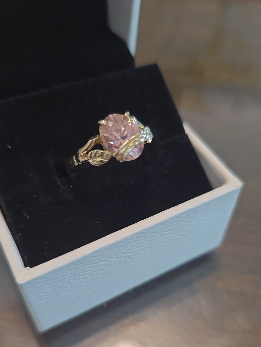 Gold Ring with Pink Gemstone and Leaf Accent